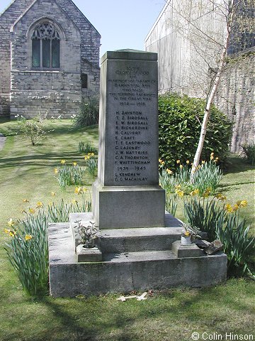 The 1914-1918 and 1939-45 War Memorial in Holy Trinity churchyard, Barkston Ash.